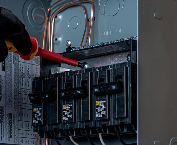 11 Piece Insulated Tool Kit - Screwdriver being used on wall - Primus Cable