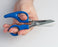 Ergonomic Electrician's Scissors - Blue handles held by hand - Primus Cable
