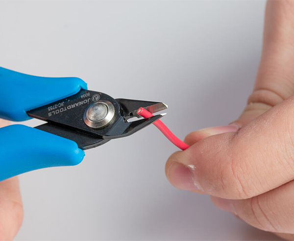 Flush Cut Pliers - In use cutting red wire - Primus Cable