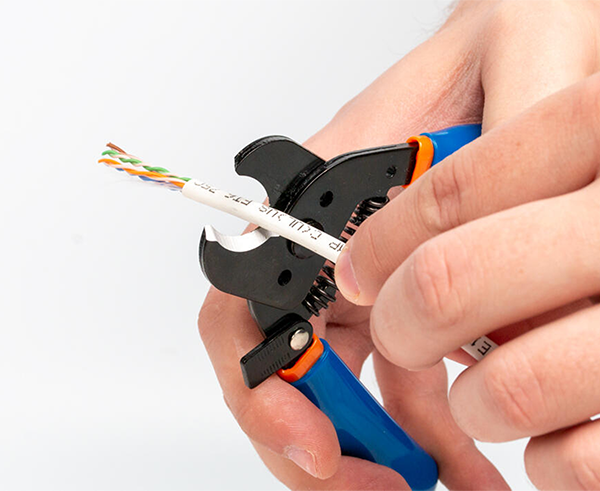Compact Cable Cutter - In use cutting white cable - Primus Cable