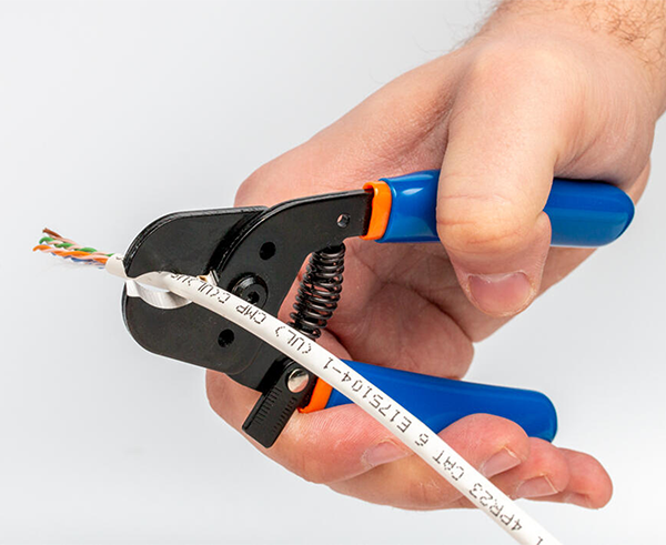 Compact Cable Cutter - In use cutting white cord - Primus Cable