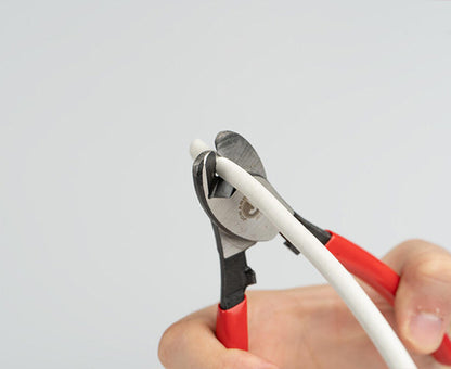 COAX Cable Cutter Steel - Close up of cutters in use cutting white cable - Primus Cable