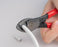 COAX Cable Cutter - Close up of cutter cutting white cable - Primus Cable