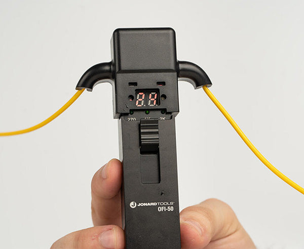 Optical Fiber Identifier - Tool in use with back numbers lit up - Primus Cable