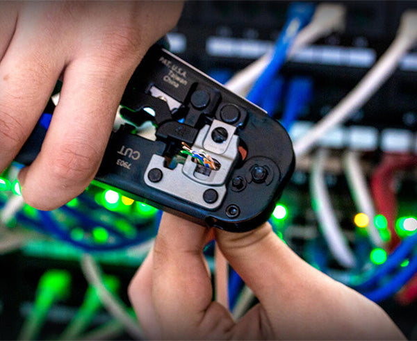 6-in-1 Crimping Tool, RJ45 Pass-through & RJ11/12 Modular - Crimper tool in use - Primus Cable
