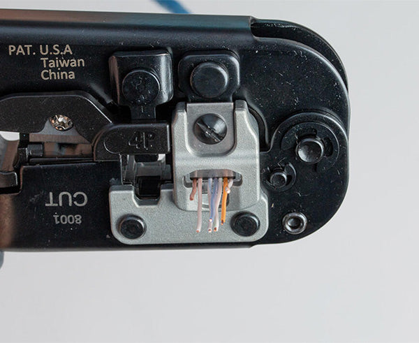 6-in-1 Crimping Tool, RJ45 Pass-through & RJ11/12 Modular - Close up of wire stripping - Primus Cable