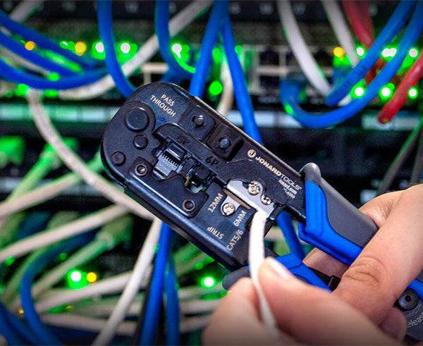 6-in-1 Crimping Tool, RJ45 Pass-through & RJ11/12 Modular - Tool in use at network tower - Primus Cable