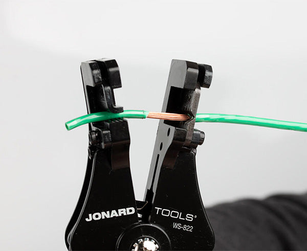Wire Stripper and Cutter, 8-22 AWG - Stripping green jacket off of copper wire - Primus Cable