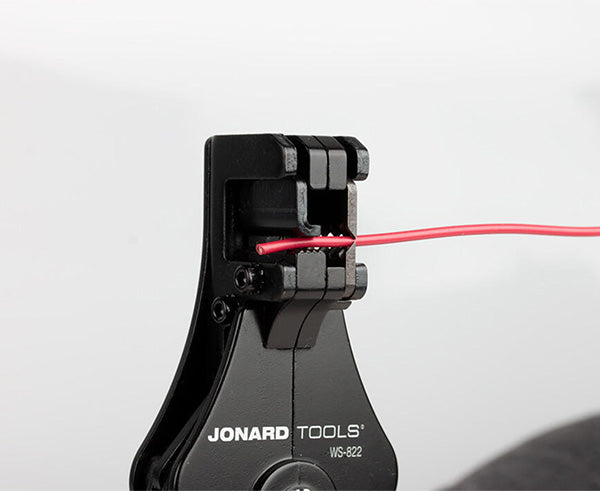 Wire Stripper and Cutter, 8-22 AWG - In use cutting red wire - Primus Cable