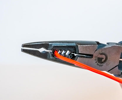Heavy-Duty Wire Stripping Pliers for 10-16 AWG - Cable stripping on bright orange wire - Primus Cable