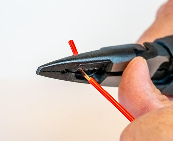 Heavy-Duty Wire Stripping Pliers for 10-16 AWG - Pliers in use on wire - Primus Cable