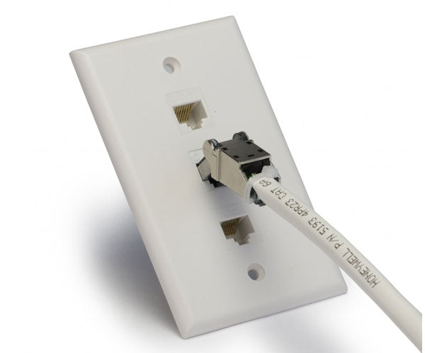 Close up of flex connector in wall plate.